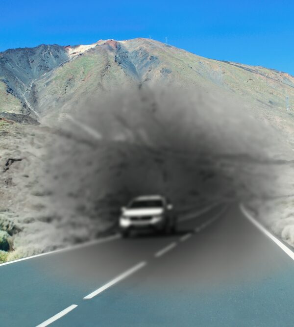 Vision Matters - car on highway with black-gray blur around it depicting low vision from macular degeneration.