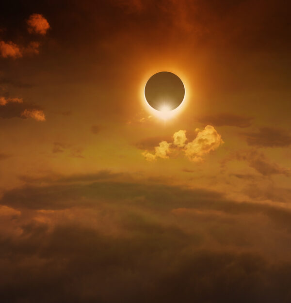 Eye-Safe Skywatching Amazing scientific background - total solar eclipse in dark red glowing sky, mysterious natural phenomenon when Moon passes between planet Earth and Sun